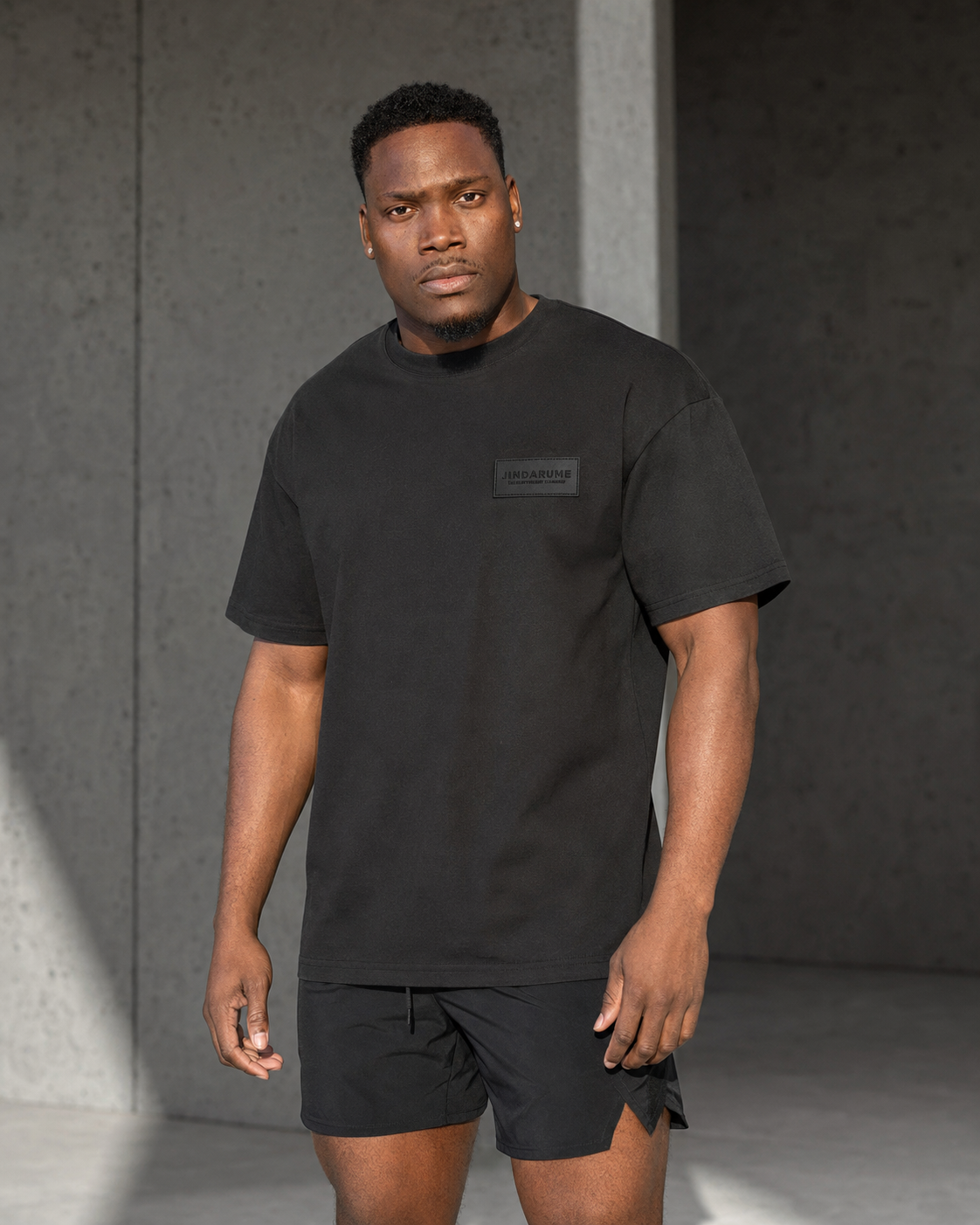 Jindarume model wearing the black Field Tee and Split Short